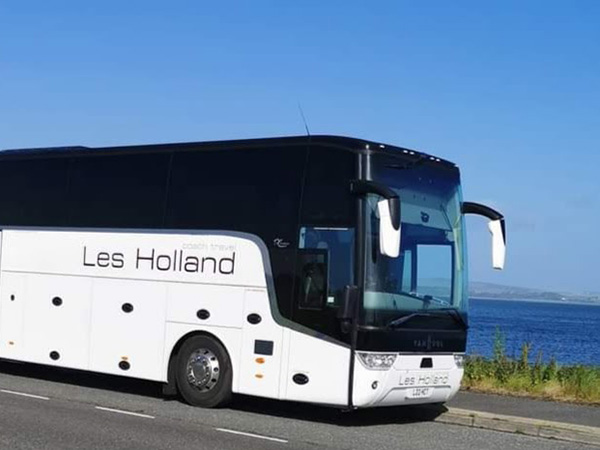 A Les Holland Coach by the sea