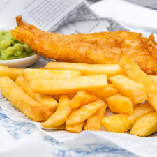 plate of fish chips and mushy peas